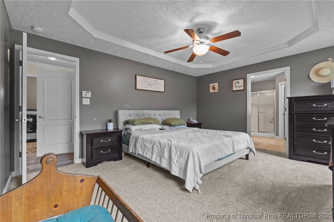 9619 Rockfish Road Raeford, NC 28376 - Photo 21 of 47 a bedroom with a bed and a dresser