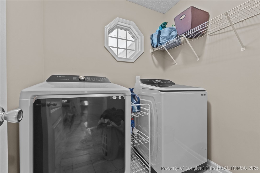 9619 Rockfish Road Raeford, NC 28376 - Photo 33 of 47 a utility room with dryer and washer
