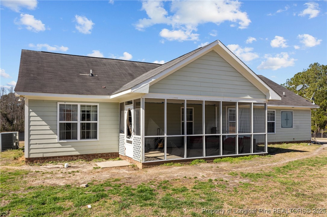9619 Rockfish Road Raeford, NC 28376 - Photo 36 of 47 a view of a house with a yard