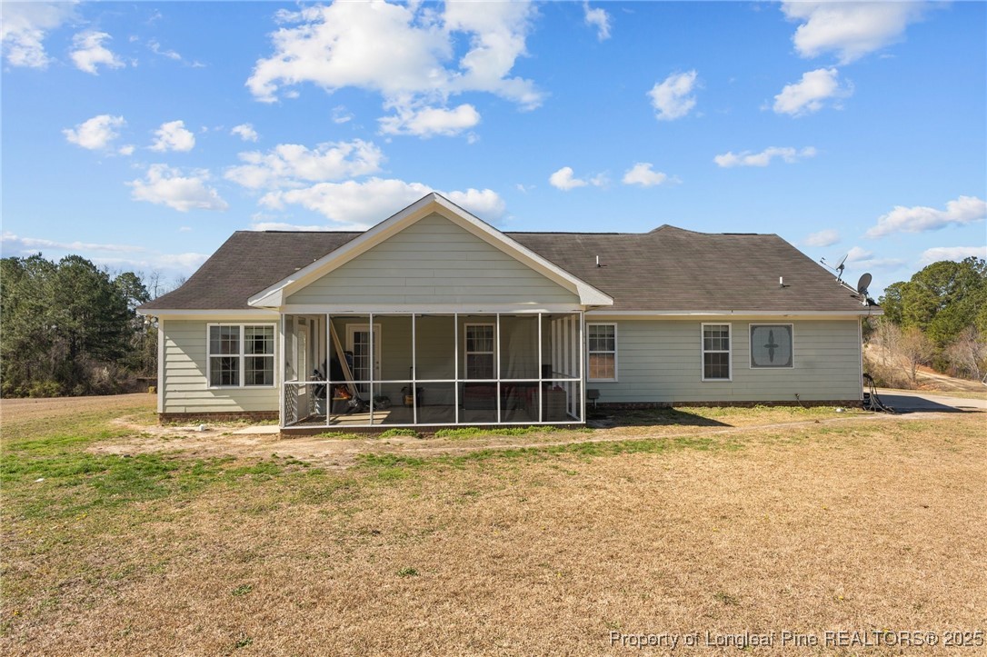 9619 Rockfish Road Raeford, NC 28376 - Photo 37 of 47 a front view of a house with a yard