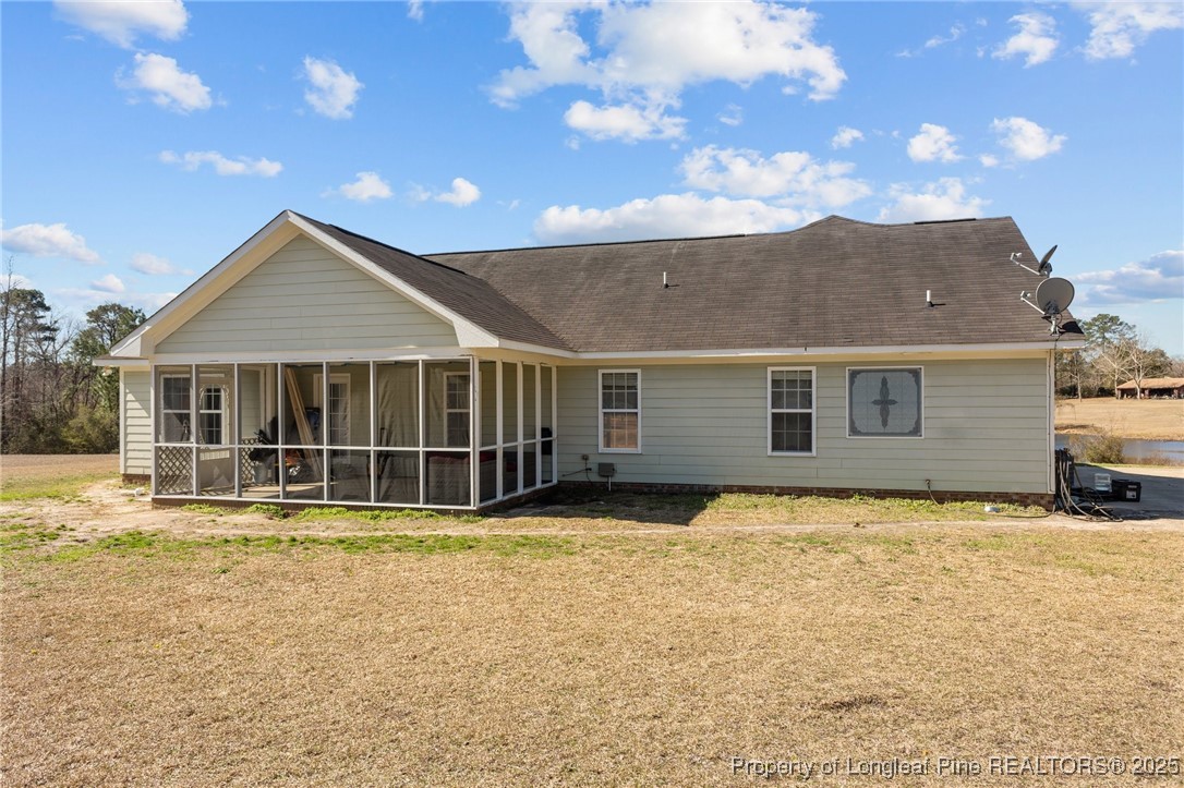 9619 Rockfish Road Raeford, NC 28376 - Photo 38 of 47 a view of a house with a yard