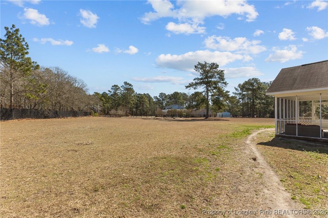 9619 Rockfish Road Raeford, NC 28376 - Photo 39 of 47 a view of a house with a yard