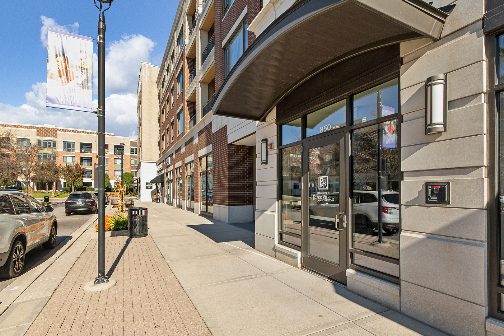 850 Village Center Drive, Unit 407 Burr Ridge, IL 60527 - Photo 1 of 29 a view of steet corner