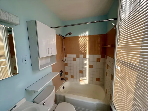 a kitchen with a stove a sink and a refrigerator