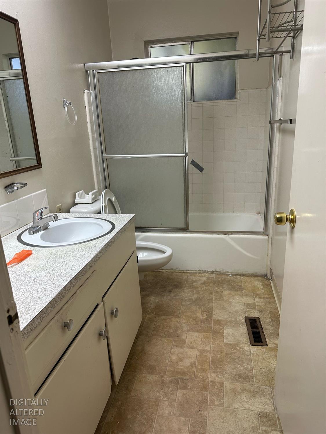 114 College Avenue Modesto, CA 95350 - Photo 12 of 19 a bathroom with a sink a toilet and shower