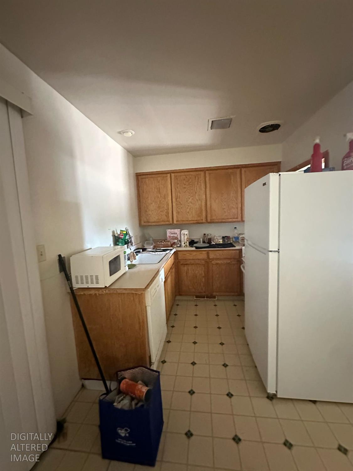 114 College Avenue Modesto, CA 95350 - Photo 19 of 19 a kitchen with refrigerator and chairs