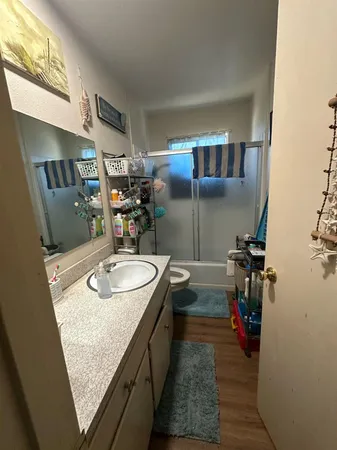 a bed sitting in a room next to a window