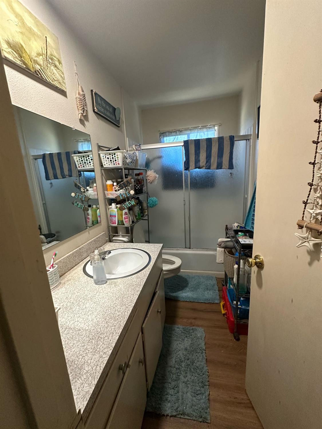 114 College Avenue Modesto, CA 95350 - Photo 5 of 19 a bathroom with sink shower and mirror