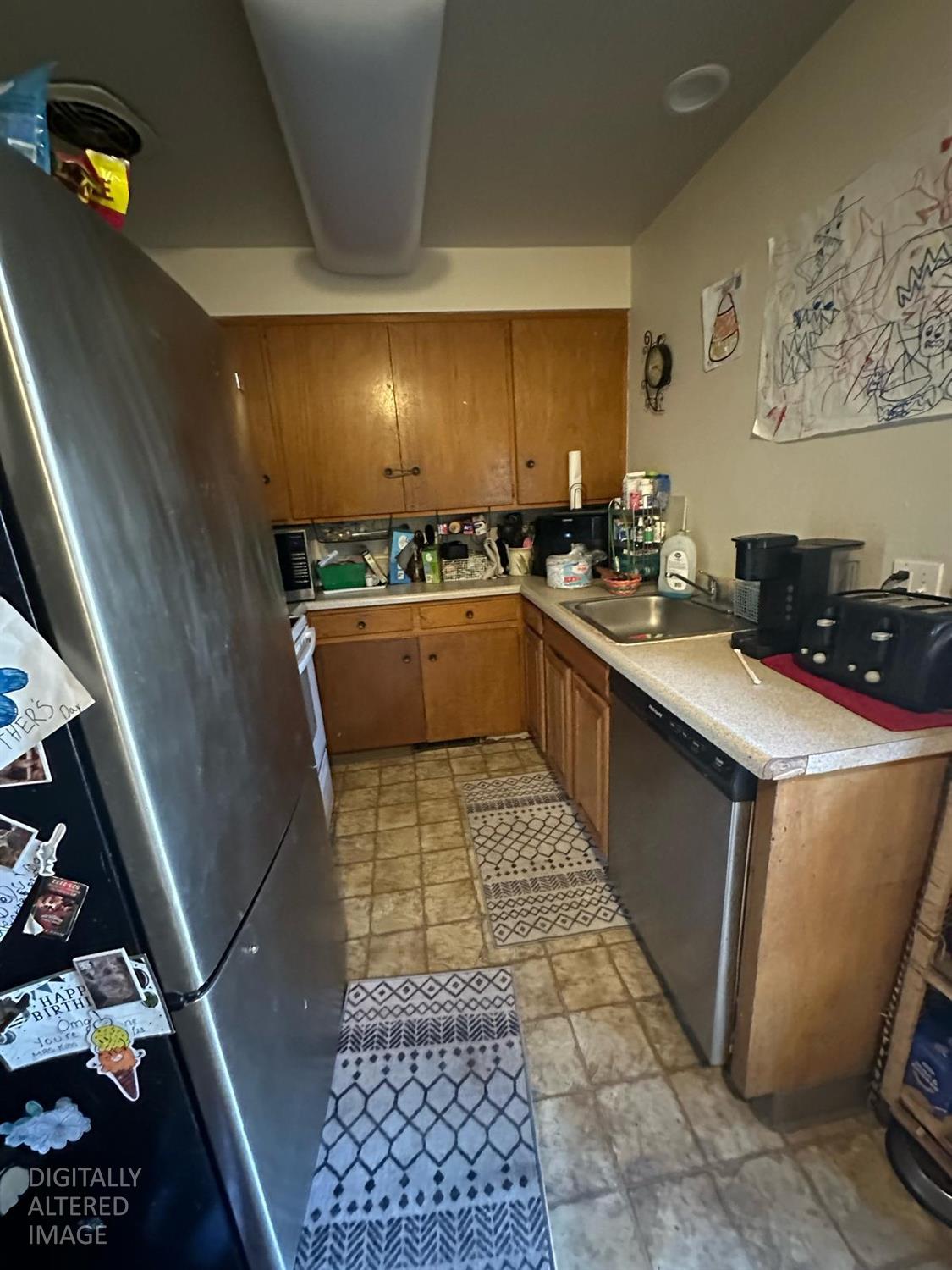 114 College Avenue Modesto, CA 95350 - Photo 7 of 19 a kitchen with stainless steel appliances granite countertop a sink stove and cabinets