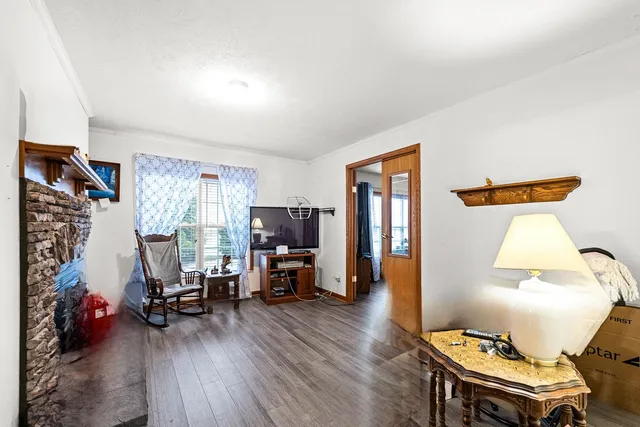 a view of swimming pool with a yard and plants