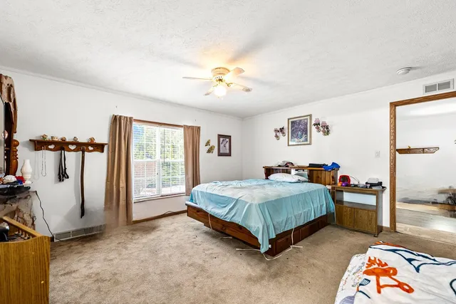 a view of a bathroom with a tub mirror and a sink