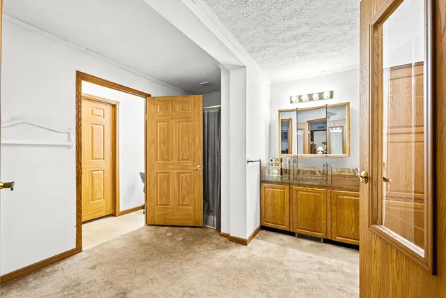 a view of a bathroom with tub shower and bedroom