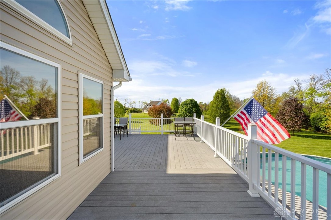 841 Willow Road Springfield, OH 45502 - Photo 41 of 64 An inviting deck overlooks a lush yard, offering ample space for outdoor enjoyment.