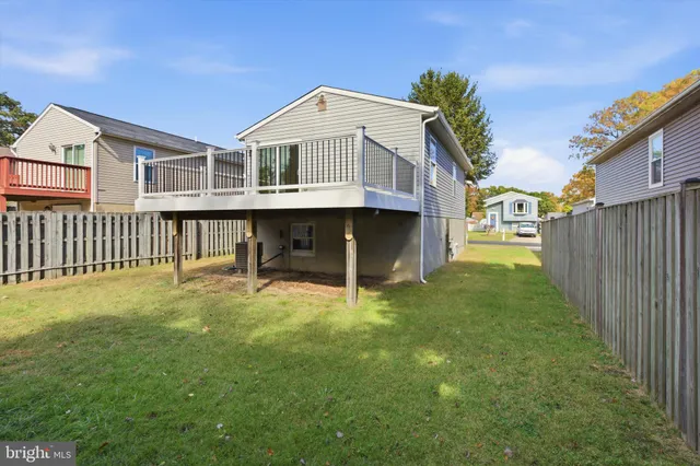 a view of a yard in front of house with a yard