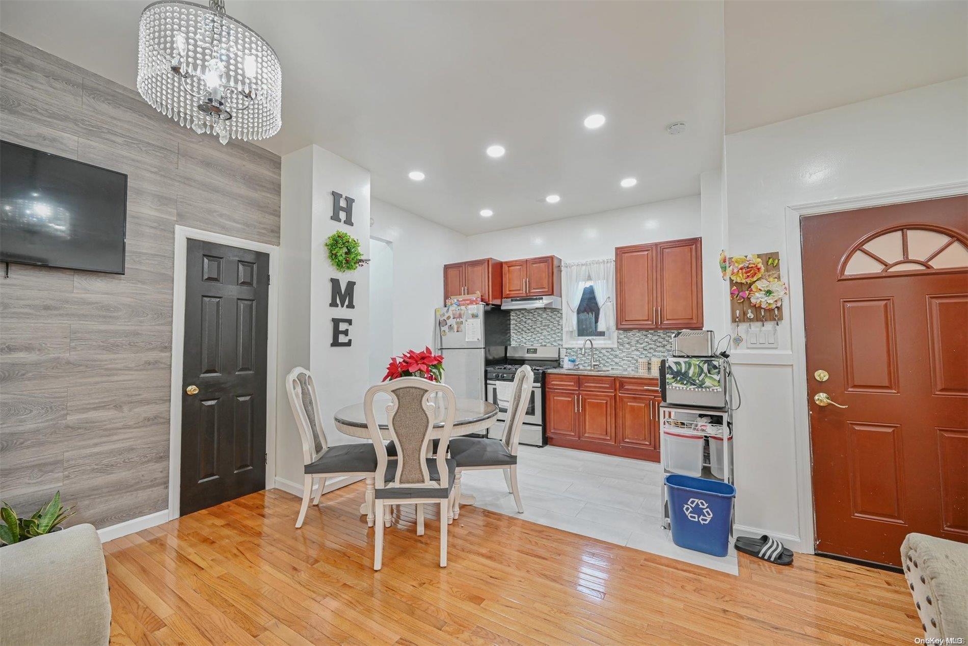 a dining room with furniture and wooden floor