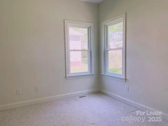 a white toilet sitting next to a bath tub