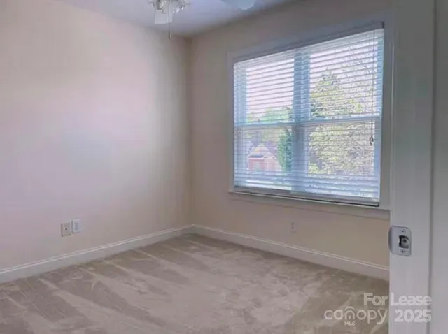 a view of a porch with a floor to ceiling window