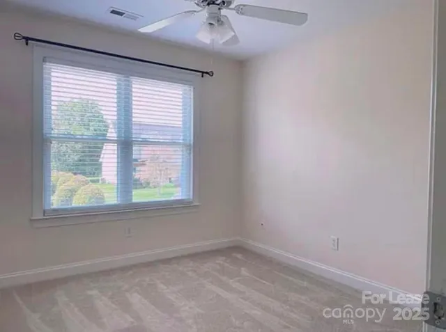 a bathroom with a double vanity sink a toilet and shower
