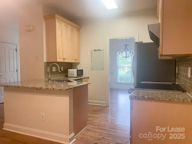 a kitchen with granite countertop a sink and a granite counter tops