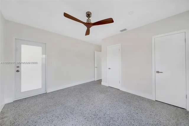 a view of a livingroom with a ceiling fan