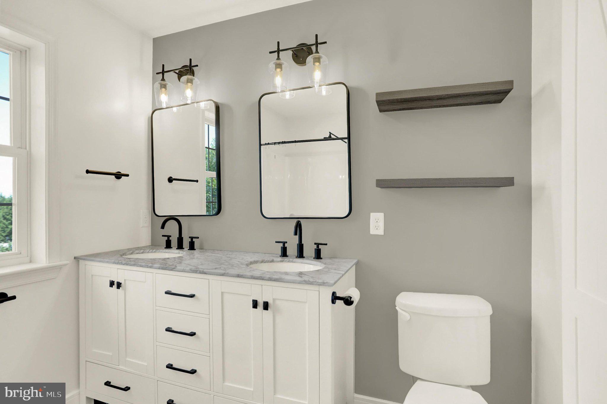 143 Spring Meadows Road Manchester, PA 17345 - Photo 14 of 48 a bathroom with a sink vanity and a mirror