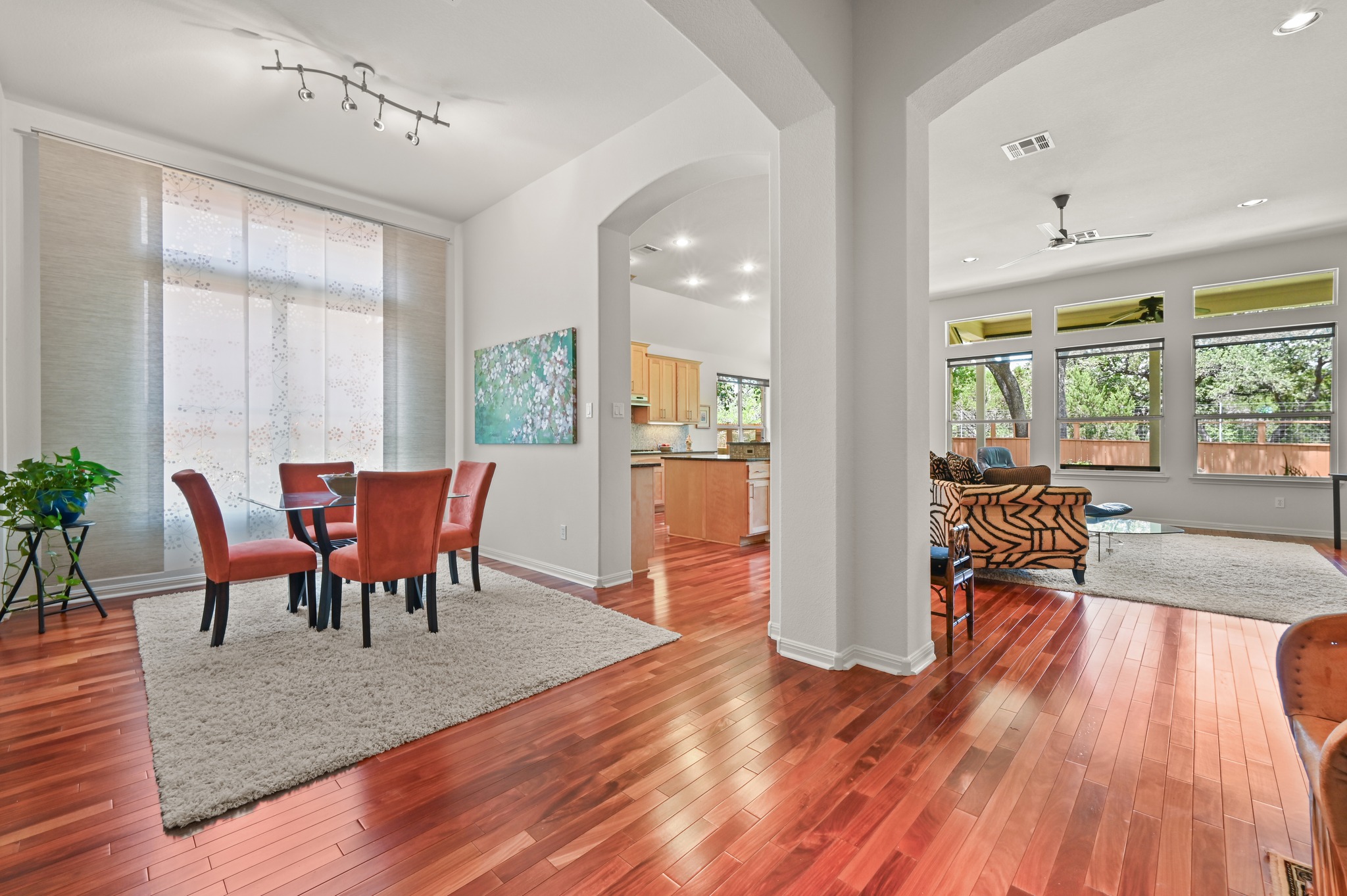 7301 Seneca Falls Loop Austin, TX 78739 - Photo 6 of 36 Beautiful Santos Mahogany wood flooring flows throughout all the main living spaces.