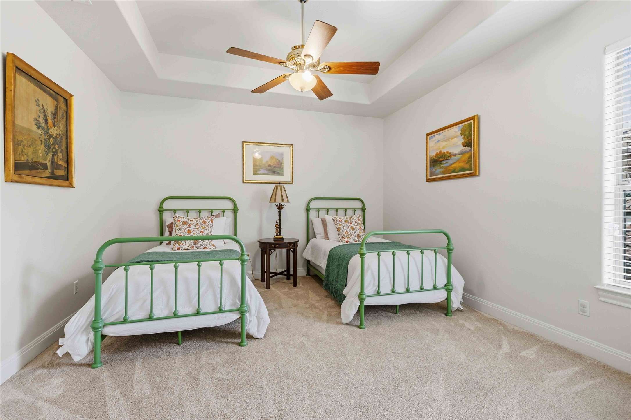 15200 Spillman Ranch Loop Austin, TX 78738 - Photo 23 of 40 This bedroom #3 upstairs room features a tray ceiling, a ceiling fan with a light fixture, and carpet flooring