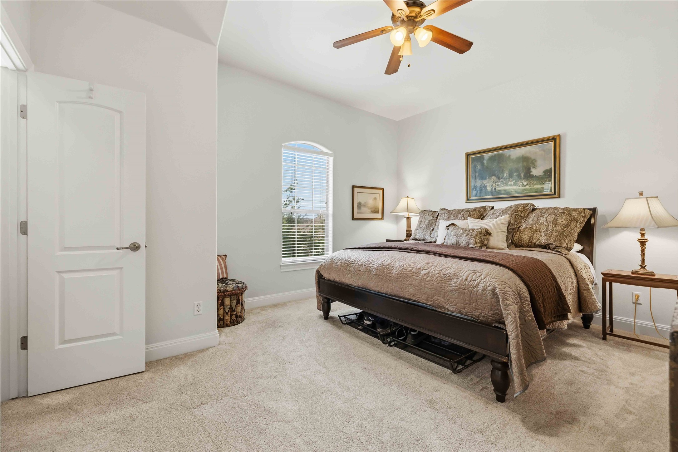 15200 Spillman Ranch Loop Austin, TX 78738 - Photo 27 of 40 Spacious upstairs bedroom #4 with plush carpeting, a large window with blinds, and a ceiling fan