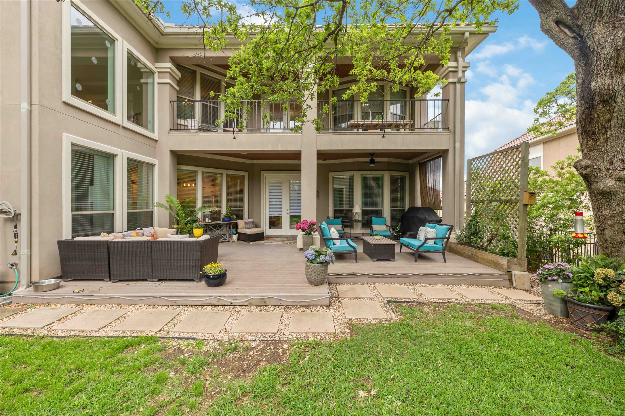 15200 Spillman Ranch Loop Austin, TX 78738 - Photo 36 of 40 The property features a tiered outdoor living space, including a lower deck and an upper balcony, both with ample room for outdoor furnishings
