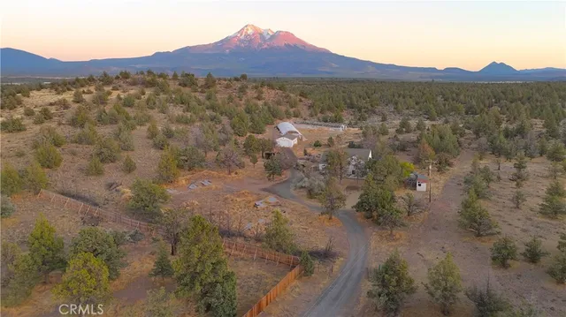 a view of a street with mountains in the background