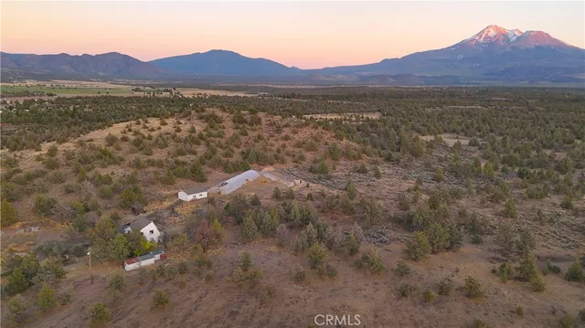 a view of a large body of water with a mountain in the background