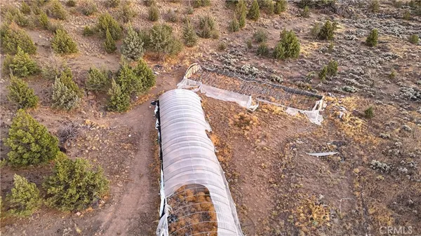 an aerial view of residential house with outdoor space