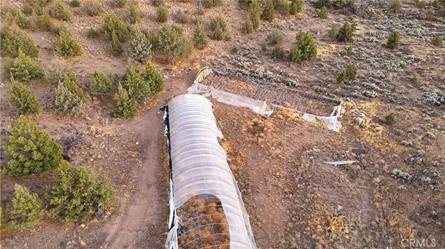 an aerial view of residential house with outdoor space