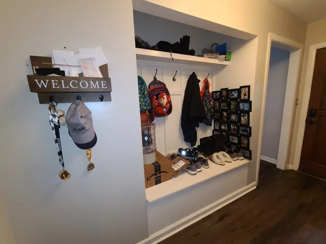 a room with bed and cabinets