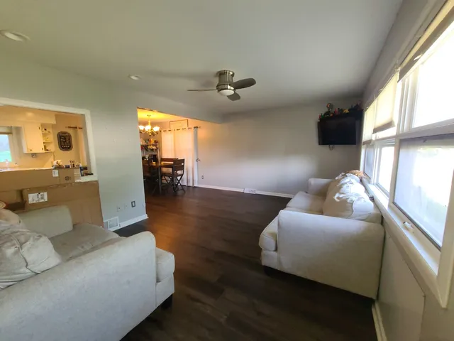 a view of furniture and floor to ceiling window