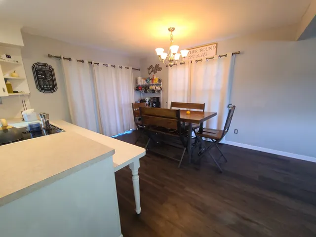 a very nice looking dining room with a large window