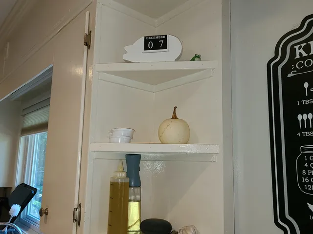 a view of kitchen with furniture and wooden floor