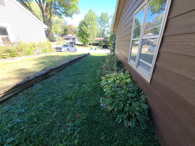 a view of swimming pool with a yard