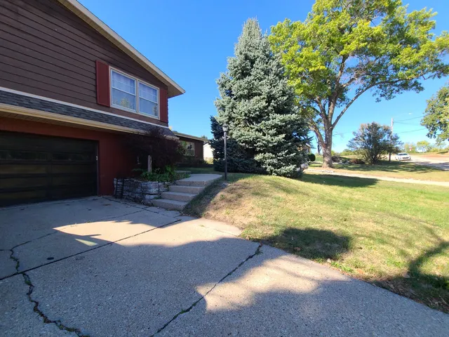 a backyard of a house with lots of green space