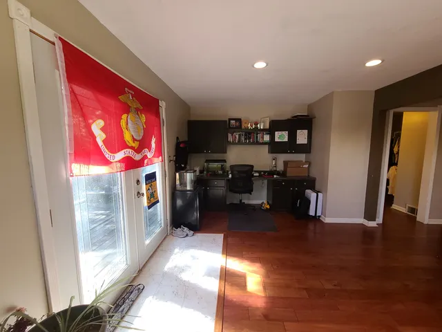 a room with furniture and a flat screen tv