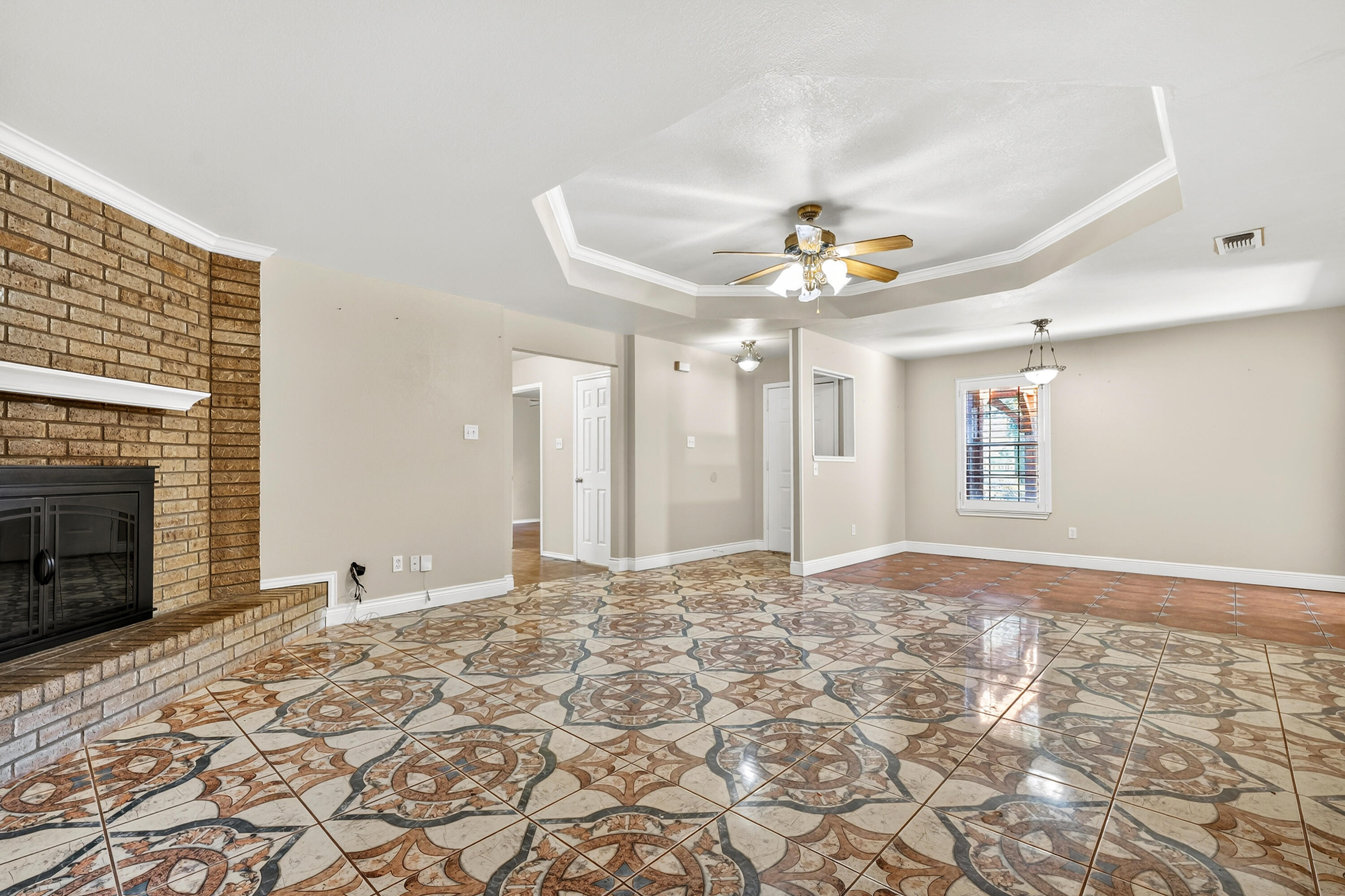 2415 93rd Street Lubbock, TX 79423 - Photo 6 of 24 a view of a livingroom with a fireplace