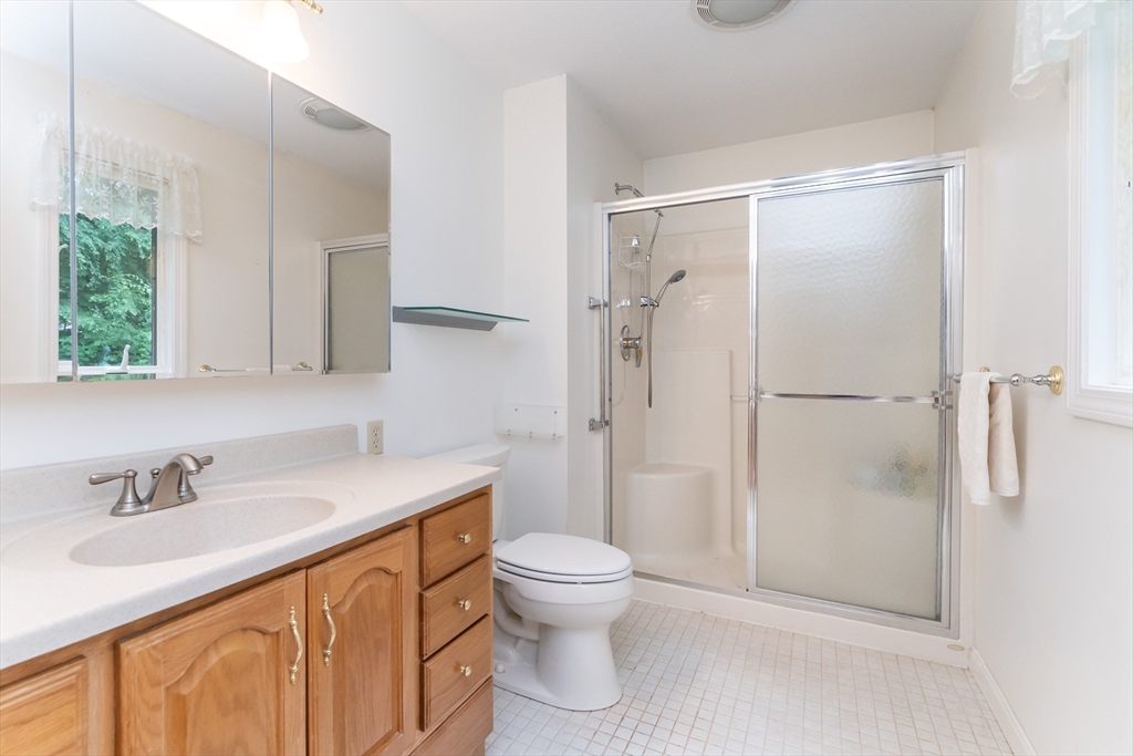 28 Hemingway Road Wilbraham, MA 01095 - Photo 40 of 42 a bathroom with a granite countertop sink toilet and shower