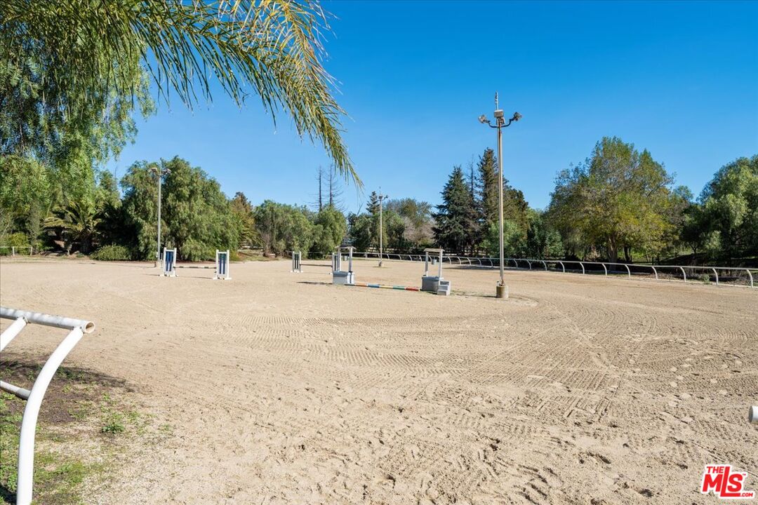 15606 Tierra Rejada Road Moorpark, CA 93021 - Photo 5 of 23 a view of a yard with a tree