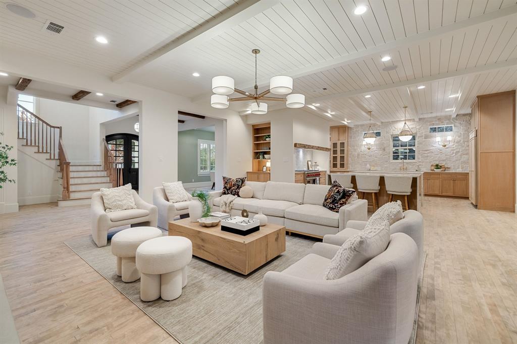 6411 Orchid Lane Dallas, TX 75230 - Photo 12 of 40 a living room with furniture kitchen view and a chandelier