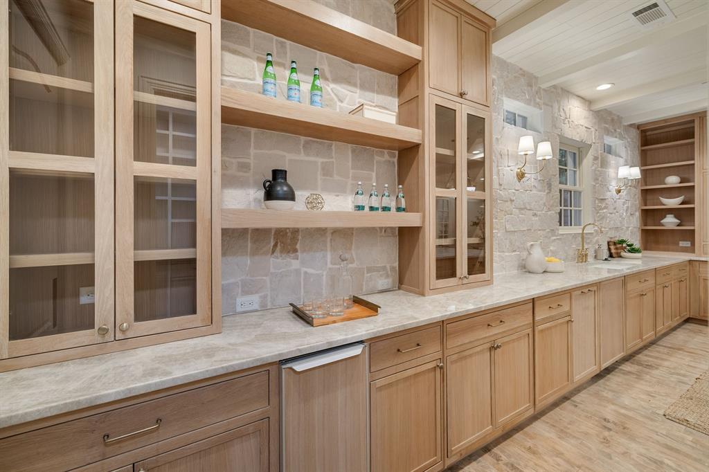 6411 Orchid Lane Dallas, TX 75230 - Photo 16 of 40 a kitchen with cabinets and window