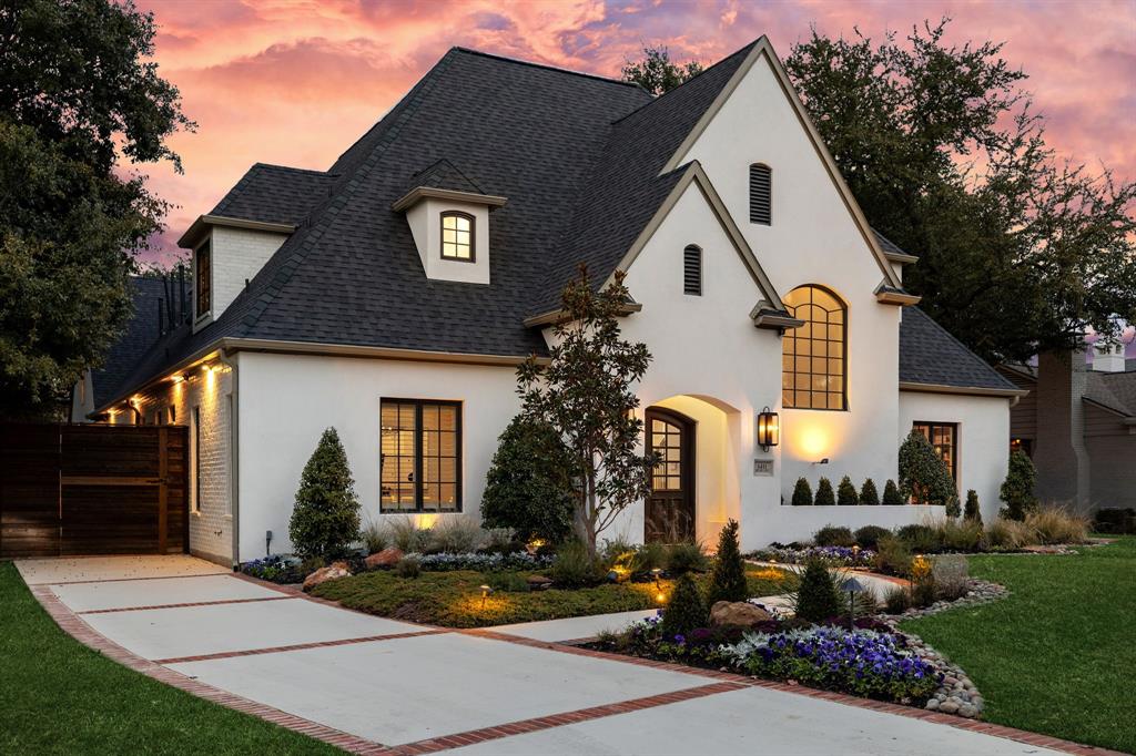 6411 Orchid Lane Dallas, TX 75230 - Photo 2 of 40 a front view of a house with garden