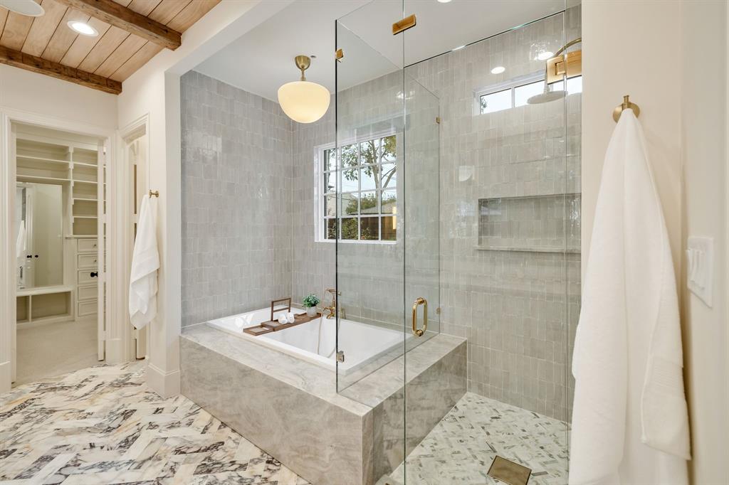 6411 Orchid Lane Dallas, TX 75230 - Photo 25 of 40 a bathroom with a tub sink and shower