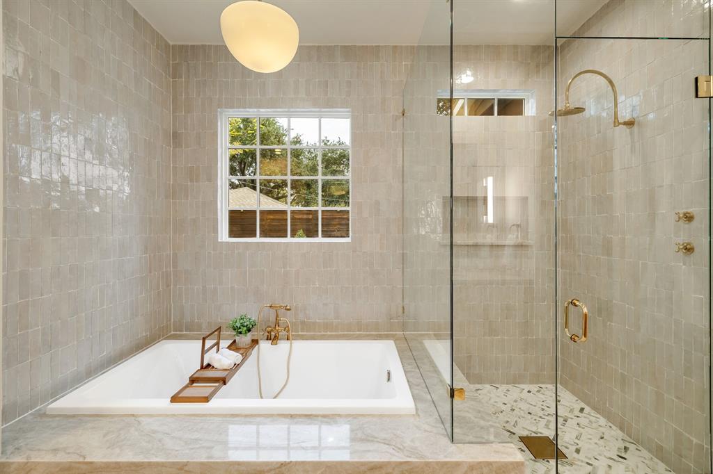 6411 Orchid Lane Dallas, TX 75230 - Photo 27 of 40 a bathroom with a tub and shower