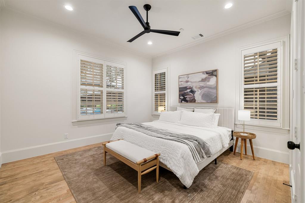 6411 Orchid Lane Dallas, TX 75230 - Photo 29 of 40 a bedroom with a bed and a large window