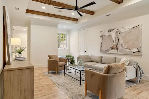 a living room with furniture and a table